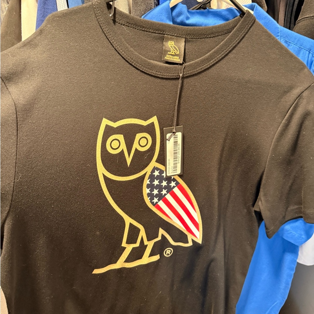 OVO Black Tee with Gold Owl and Flag Design
